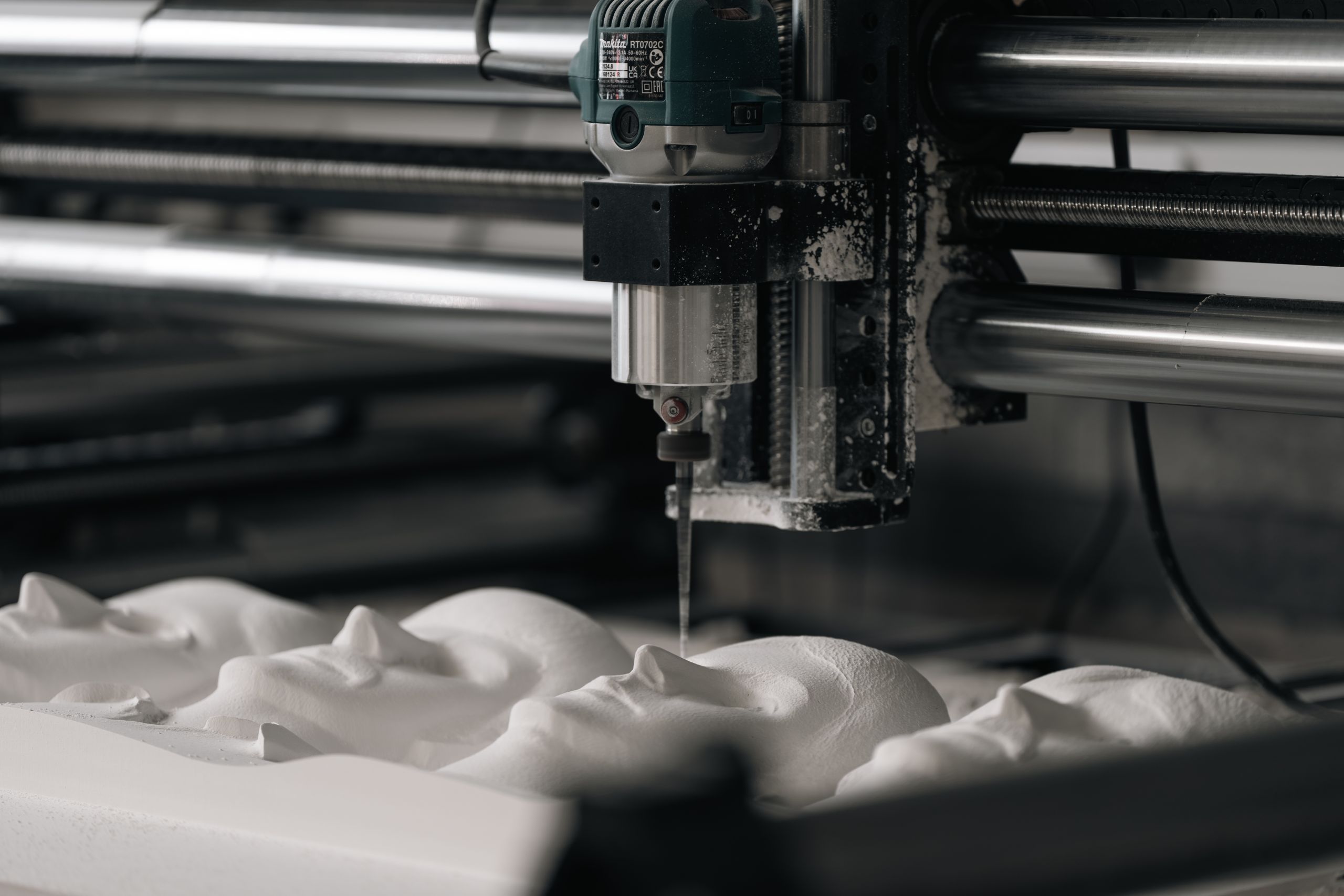 A 3D tactile relief of the Beatles is being carved on a CNC machine