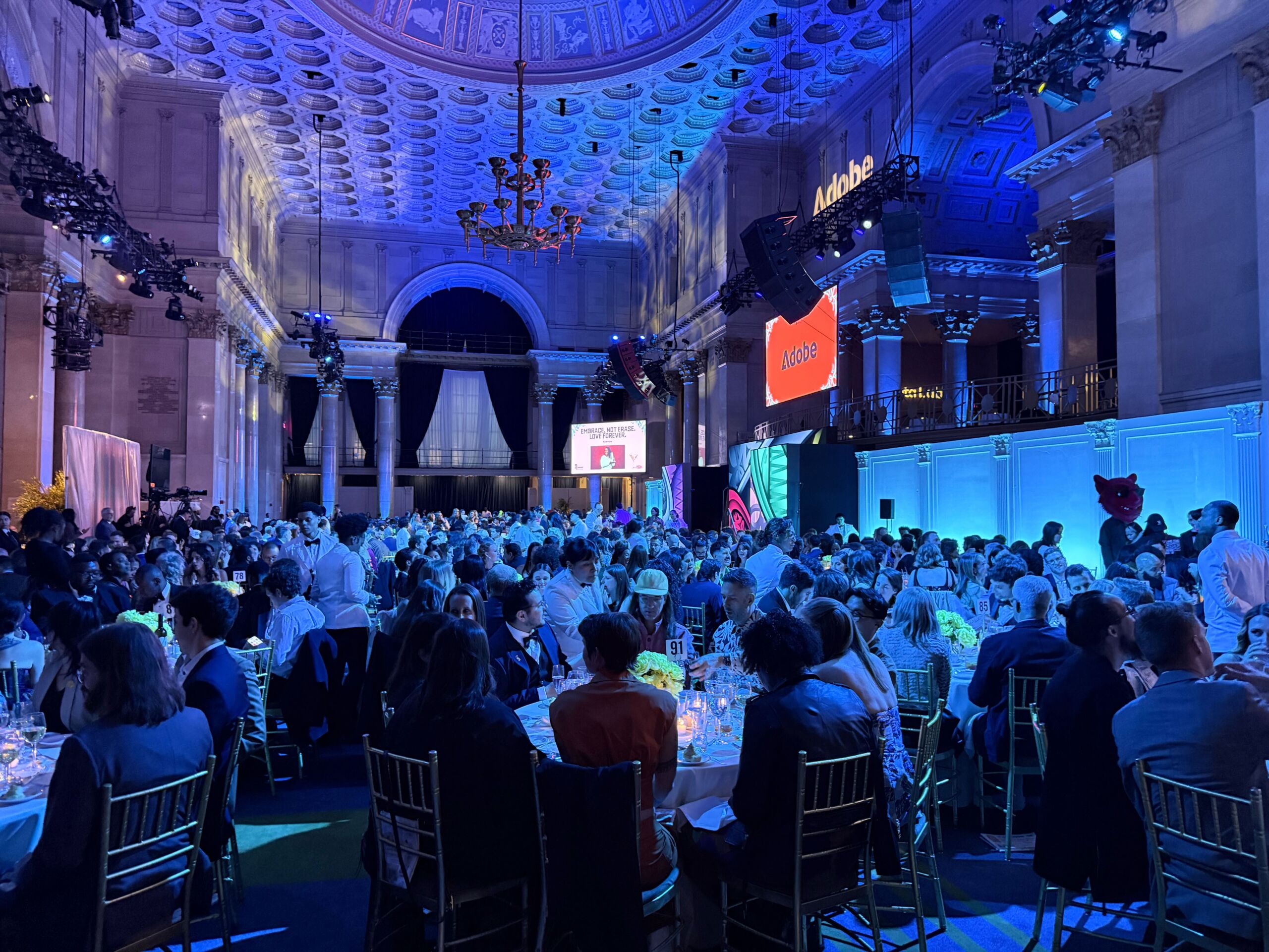 Inside The Webby Awards Wide view of the 30th Annual Webby Awards ceremony at Cipriani Wall Street in New York City, showing a large audience seated beneath an illuminated vaulted ceiling as presentations take place on stage.